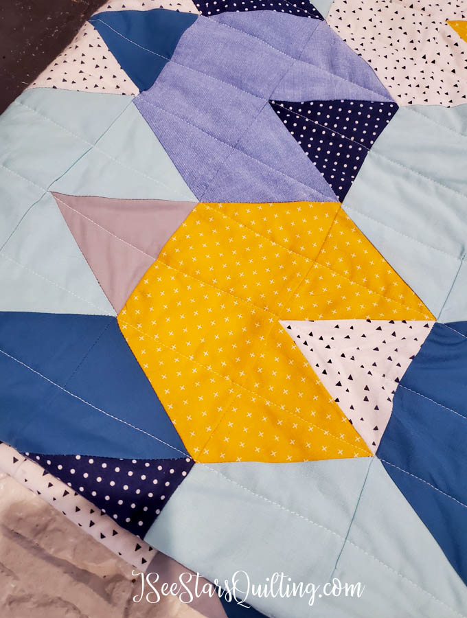 This "Baby Mountains" Hexagon quilt is made using a half-hexagon and triangle template. I love the earthy vibe that it has while still having the soft fabrics for baby quilt perfection!