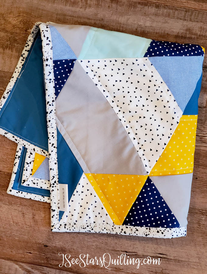 This "Baby Mountains" Hexagon quilt is made using a half-hexagon and triangle template. I love the earthy vibe that it has while still having the soft fabrics for baby quilt perfection!